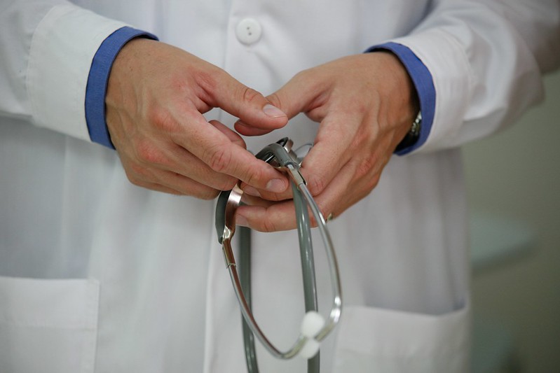 A close-up of a stethoscope held by a doctor.